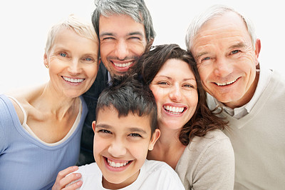 Cheerful multi generational family smiling together