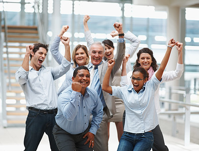 Business success - Happy multi ethnic team with hands raised