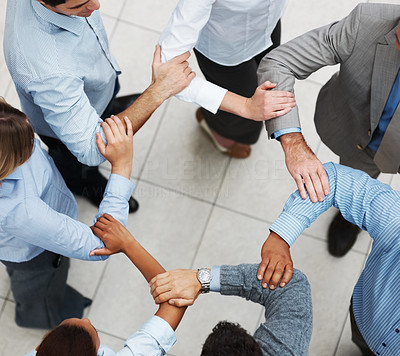Business people linking hands in teamwork