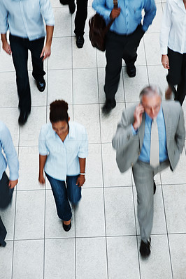 Top view of business executives walking on tiled floor