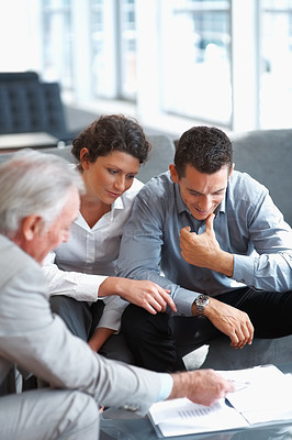 Banking agent explaining an investment scheme to a couple
