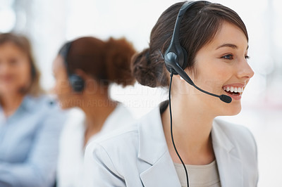 Service with a smile - Closeup of a pretty call center employee