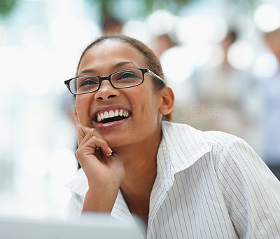 Young business woman laughing over a thought