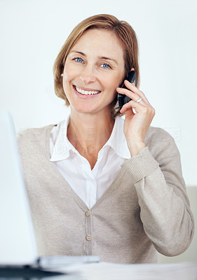 Portrait of happy business woman talking on mobile phone
