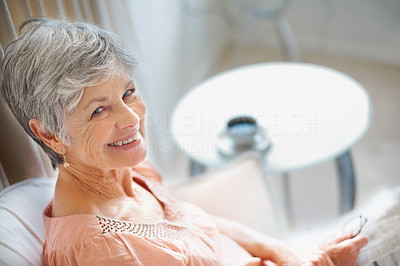 Closeup of a happy old woman smiling at you with copyspace