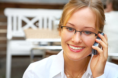 Female businesswoman making a phone call.