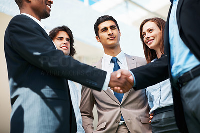 Hand shake between associates