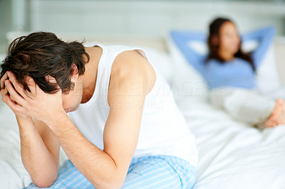 Young couple having a relationship conflict in bedroom