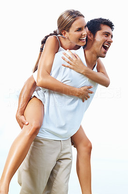 Couple enjoying while piggyback ride