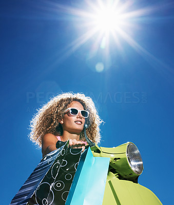 Closeup portrait of a beautiful young lady carrying shopping bag