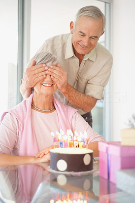 Birthday surprise - Senior man surprising his wife