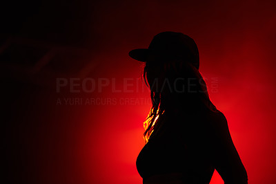 Trendy partygoer in silhouette