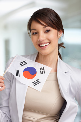 Happy young female with a Korean flag