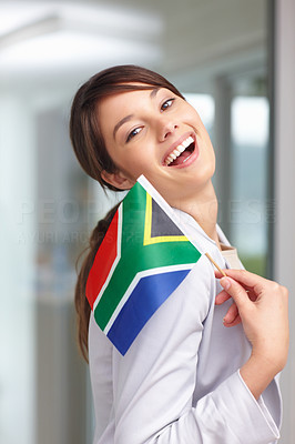 Lovely young woman with a South African flag