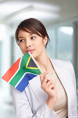 Happy young woman with a South African flag