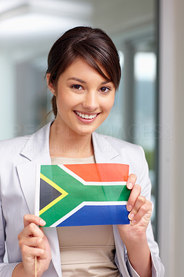 Attractive young woman with a South African flag