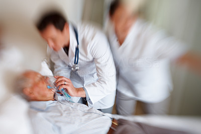 Blur motion - Doctors treating a patient for a heart attack