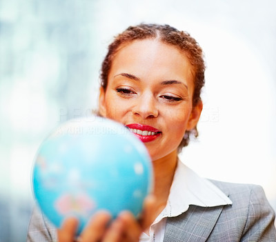 Cute business woman with a world globe