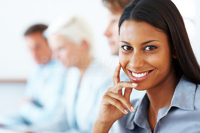 Pretty young woman at a conference smiling