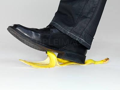 Business risk concept - Man stepping on banana peel