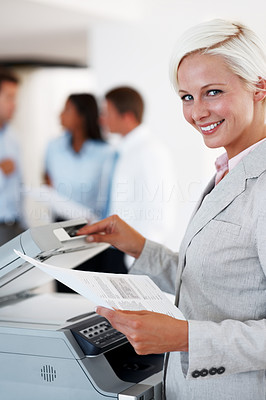 Business woman taking out a Xerox copy