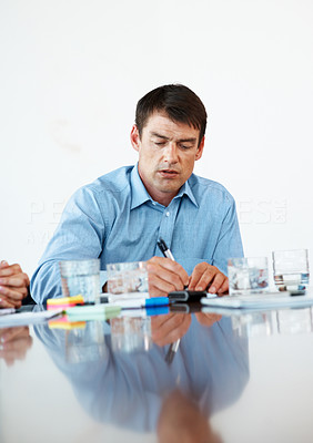 Young business man busy working at his desk