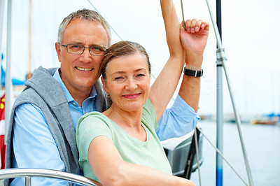 Portrait of a happy senior couple on a sea voyage