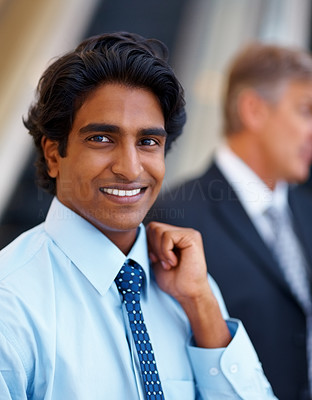 Portrait of a young Asian business man smiling
