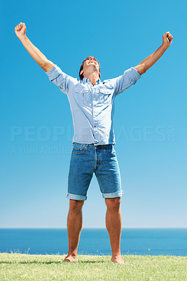 Man in park with arms outstretched
