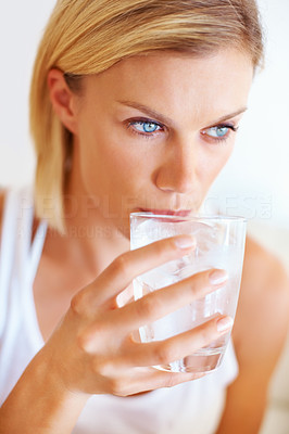 Charming woman drinking water