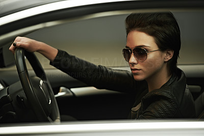 Stylish in her shades and luxury car