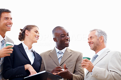 Successful business partners busy in a conversation over white background