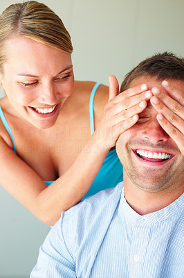 Cheerful woman covering his boyfriend\'s eyes to surprise him