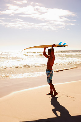 Full length portrait of a young guy with a surfboard