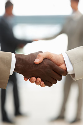 Multiracial handshake between two business men