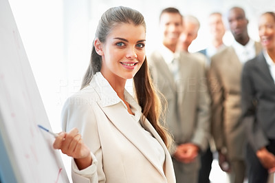 Young business woman lecturing a business team