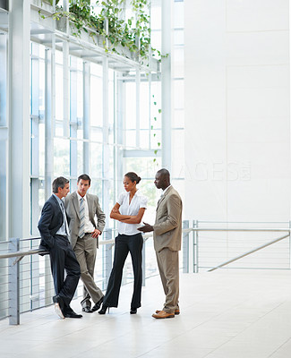 Business people having a discussion at the hallway