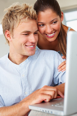 A lovely couple working on a laptop