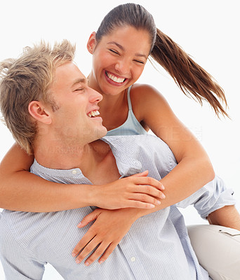 Lovely couple smiling over a white background - piggyback