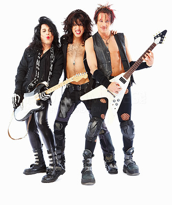 Full length portrait of rockstars with guitars, posing over white