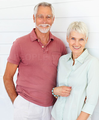 Portrait of a cute old couple in love standing together