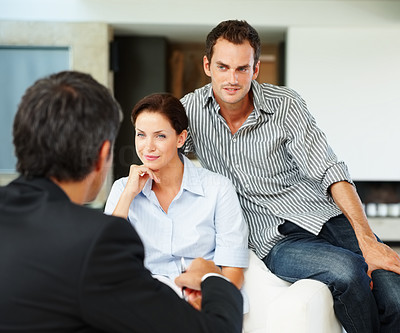 Happy young couple at meeting with a financial planner