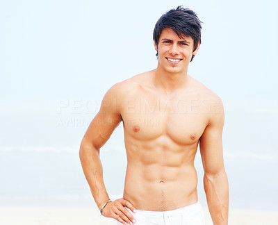 Smiling masculine young man standing outside