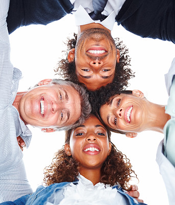 Upward view of business people with their heads together on a white background