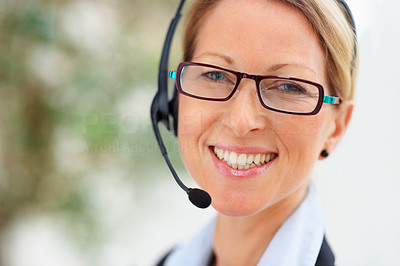 Portrait of confident pretty joyful business woman speaking using headset