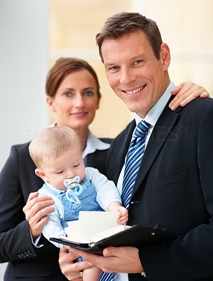 Successful business couple with their cute baby