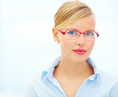 Closeup of smiling woman looking through glasses on a white background