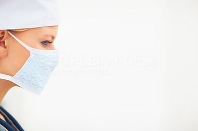 Profile image of young lady surgeon wearing face mask