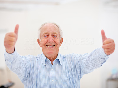 Closeup of old man giving double thumbs up