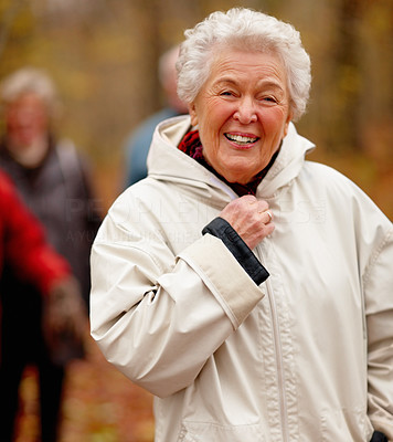 Autumn - Portrait of older women zipping up jacket